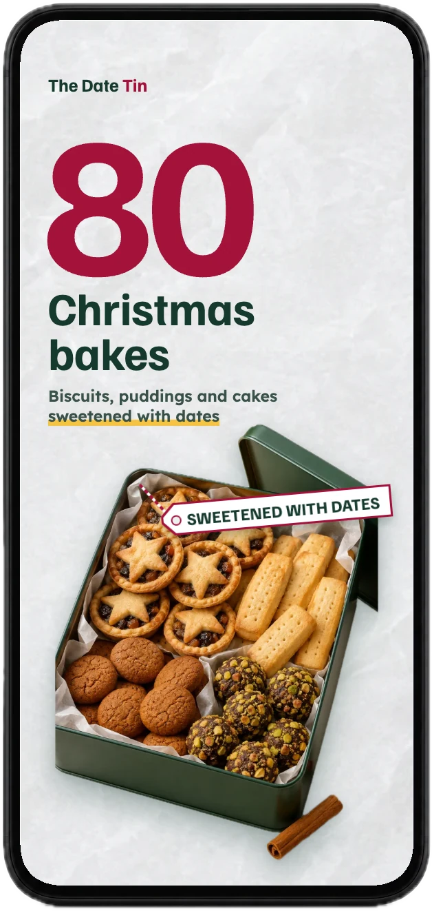 The cover of Christmas Bakes Sweetened with Dates, with 80 recipes, on a phone